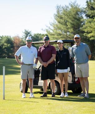 golfers with cart